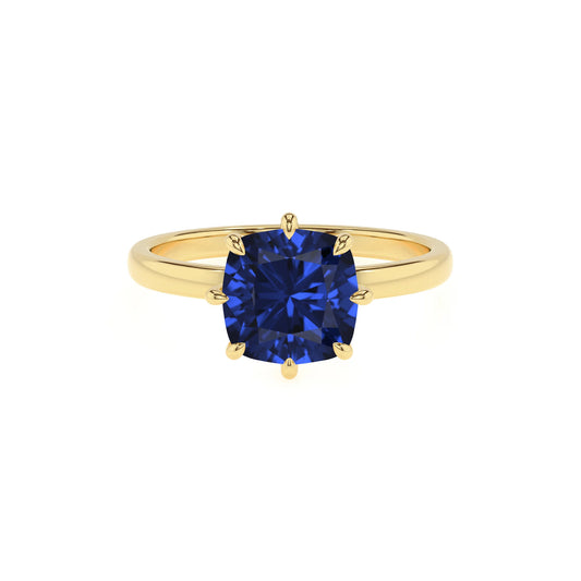lab grown blue-sapphire cushion solitaire rings in yellow gold 