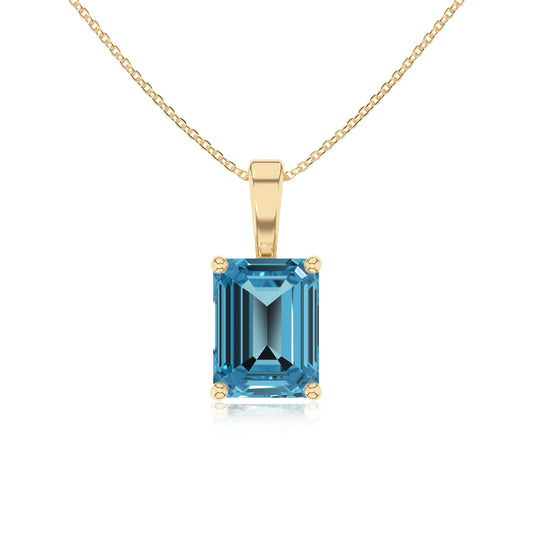 natural swiss-blue-topaz emerald cut solitaire necklaces in yellow gold 