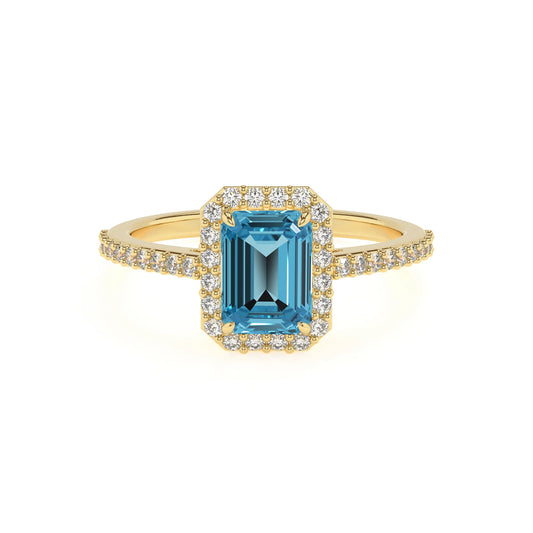 natural swiss-blue-topaz emerald cut solitaire rings in yellow gold 