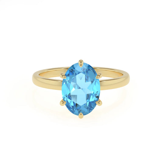 natural swiss-blue-topaz oval solitaire rings in yellow gold 