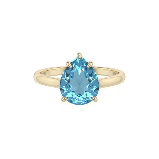 natural swiss-blue-topaz pear solitaire rings in yellow gold 