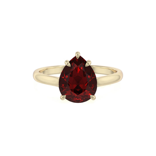 natural garnet pear solitaire rings in yellow gold 