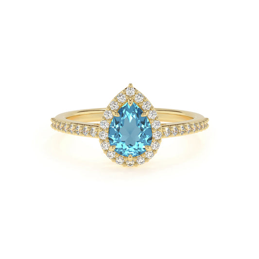 natural swiss-blue-topaz pear solitaire rings in yellow gold 