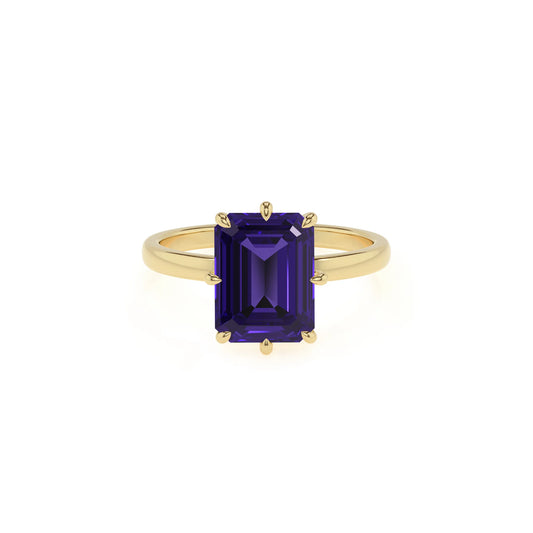 lab grown tanzanite emerald cut solitaire rings in yellow gold 