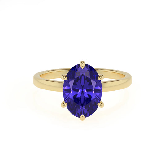 lab grown tanzanite oval solitaire rings in yellow gold 
