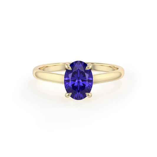 lab grown tanzanite oval solitaire rings in yellow gold 