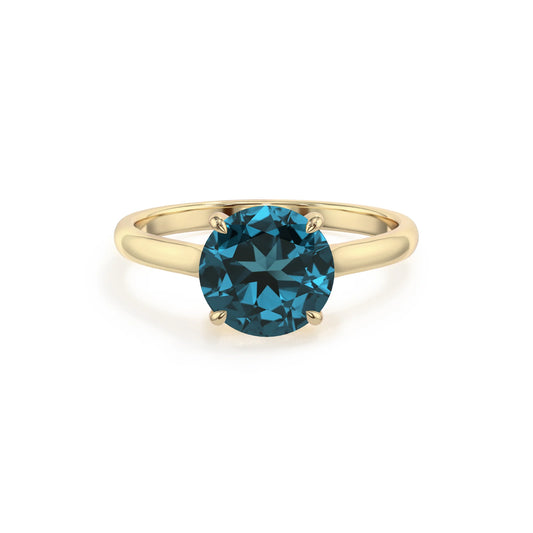 natural london-blue-topaz round solitaire rings in yellow gold 