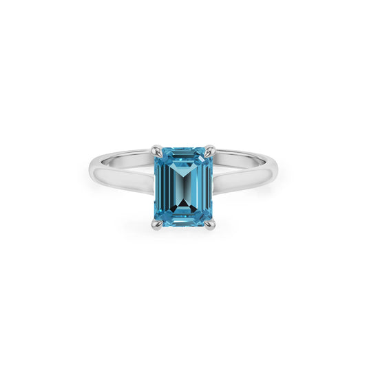 natural swiss-blue-topaz emerald cut solitaire rings in platinum 