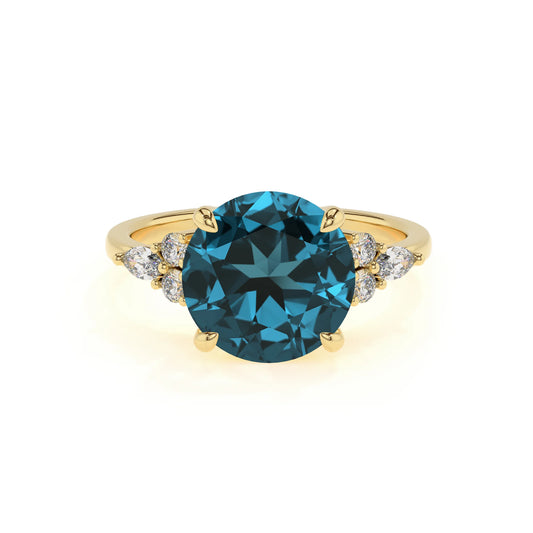 natural london-blue-topaz round solitaire rings in yellow gold 
