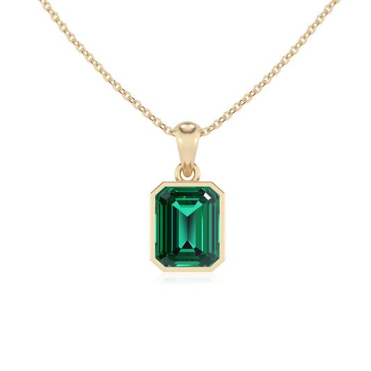 lab grown emerald octogon cut solitaire necklaces in yellow gold 