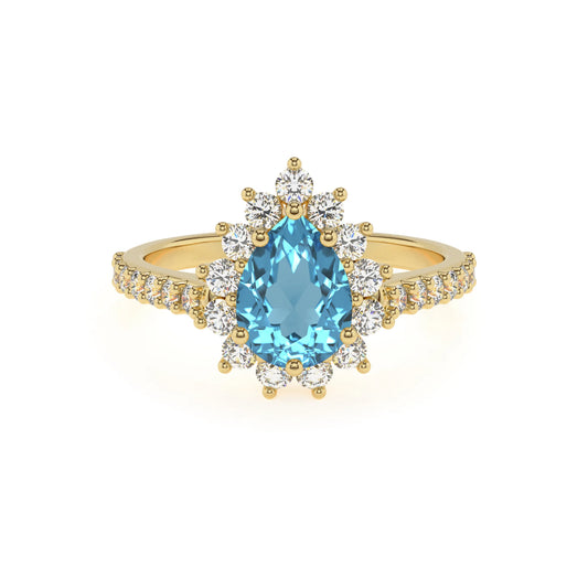 natural swiss-blue-topaz pear solitaire rings in yellow gold 
