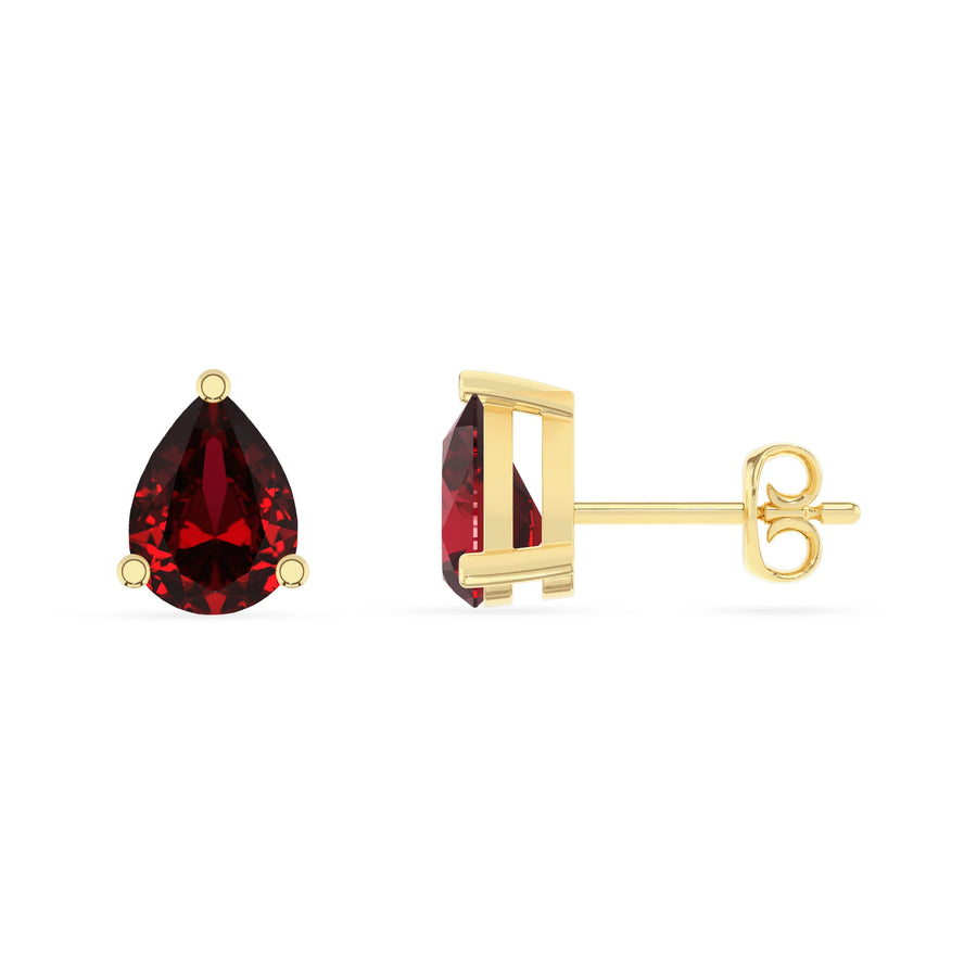 lab grown ruby pear stud earrings in yellow gold 