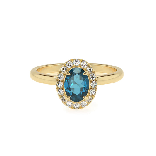 natural london-blue-topaz oval solitaire rings in yellow gold 