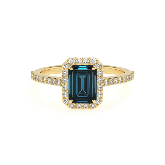 natural london-blue-topaz emerald cut solitaire rings in yellow gold 