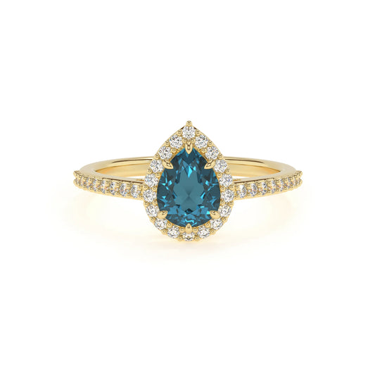 natural london-blue-topaz pear solitaire rings in yellow gold 