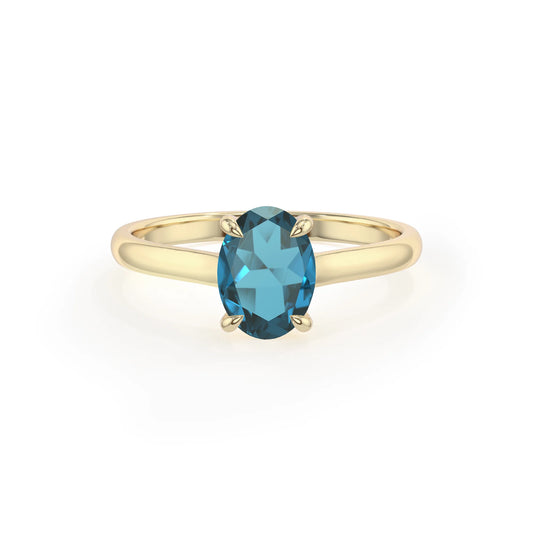 natural london-blue-topaz oval solitaire rings in yellow gold 