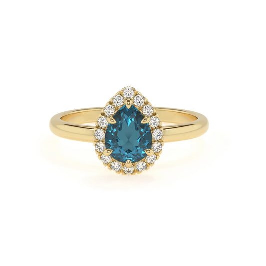 natural london-blue-topaz pear solitaire rings in yellow gold 