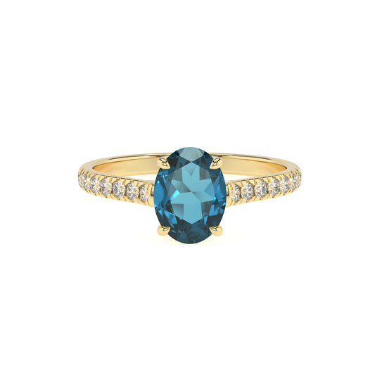 natural london-blue-topaz oval half eternity solitaire engagement rings in yellow gold 