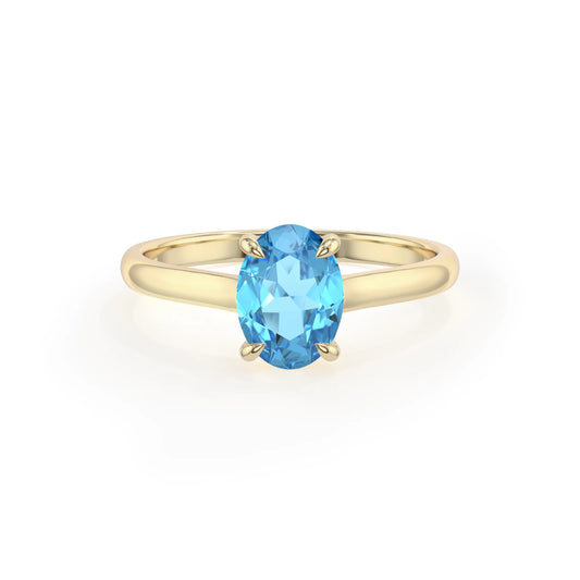 natural swiss-blue-topaz oval solitaire rings in yellow gold 