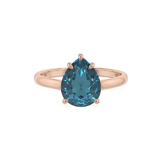 natural london-blue-topaz pear solitaire rings in rose gold 