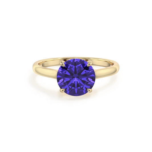 lab grown tanzanite round solitaire rings in yellow gold 