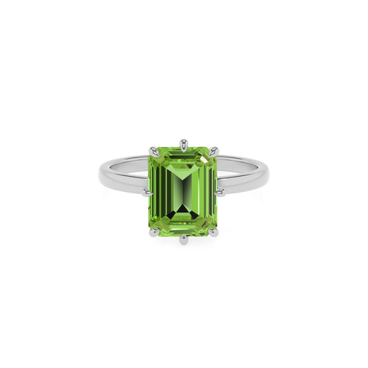 natural peridot emerald cut solitaire rings in white gold 