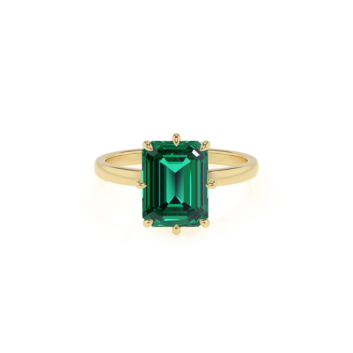 lab grown emerald octogon cut solitaire rings in yellow gold 