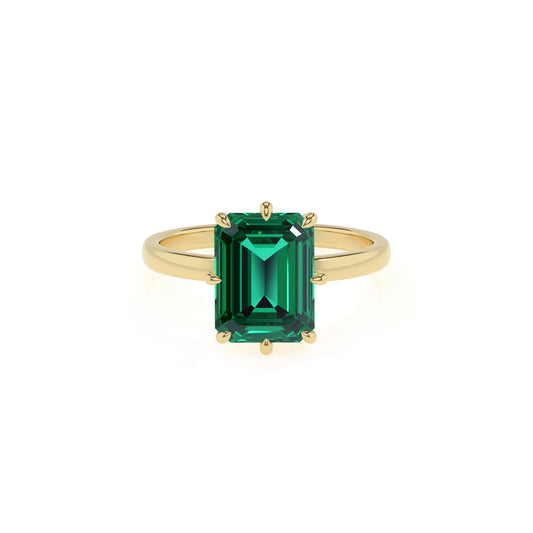 lab grown emerald octogon cut solitaire rings in yellow gold 