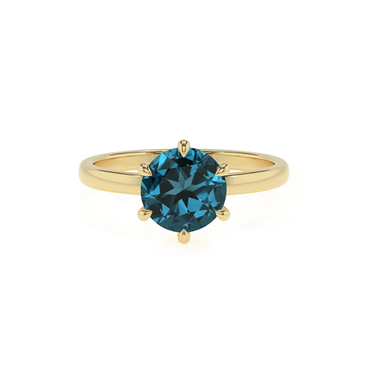 natural london-blue-topaz round solitaire rings in yellow gold 