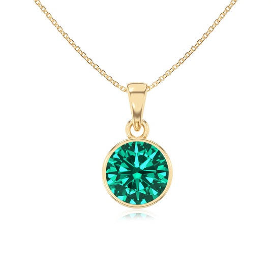 lab grown emerald round solitaire necklaces in yellow gold 