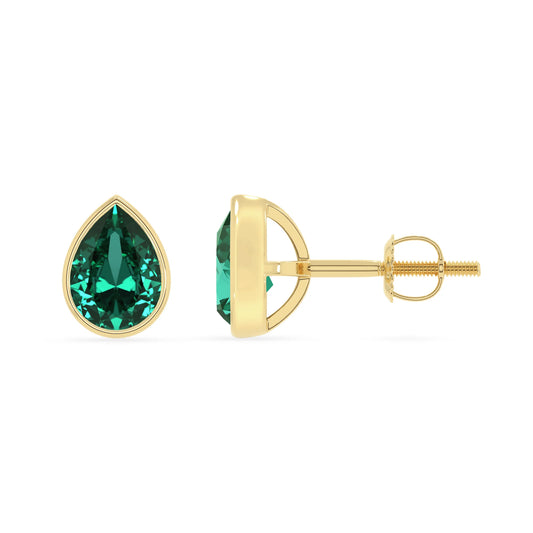 lab grown emerald pear stud earrings in yellow gold 