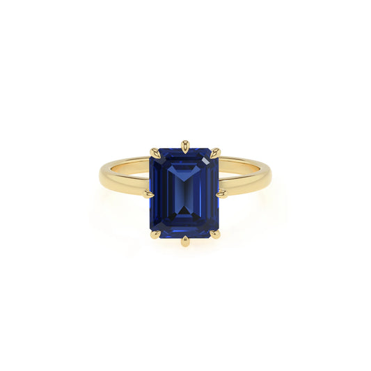 lab grown blue-sapphire emerald cut solitaire rings in yellow gold 