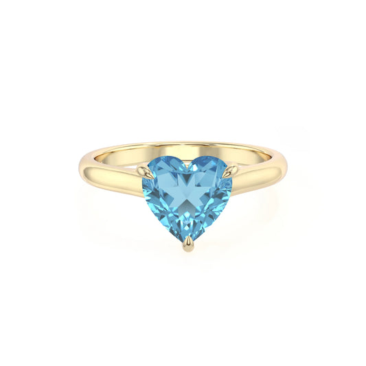 natural swiss-blue-topaz heart solitaire rings in yellow gold 