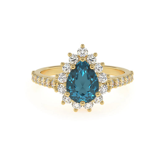 natural london-blue-topaz pear solitaire rings in yellow gold 