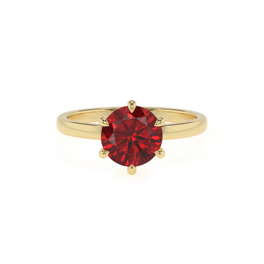 lab grown ruby round solitaire rings in yellow gold 
