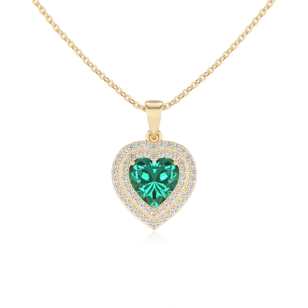 lab grown emerald heart halo necklaces in yellow gold 