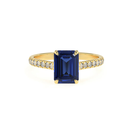 lab grown blue-sapphire emerald cut half eternity solitaire engagement rings in yellow gold 
