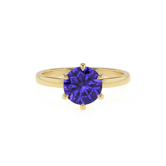 lab grown tanzanite round solitaire rings in yellow gold 