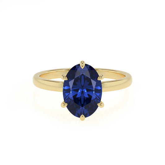 lab grown blue-sapphire oval solitaire rings in yellow gold 