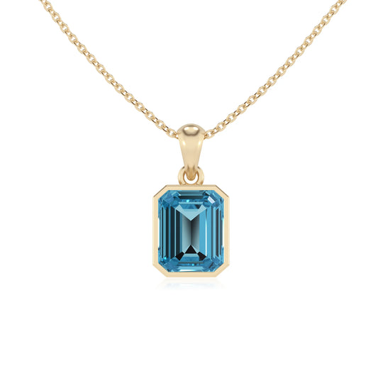 natural swiss-blue-topaz emerald cut solitaire necklaces in yellow gold 
