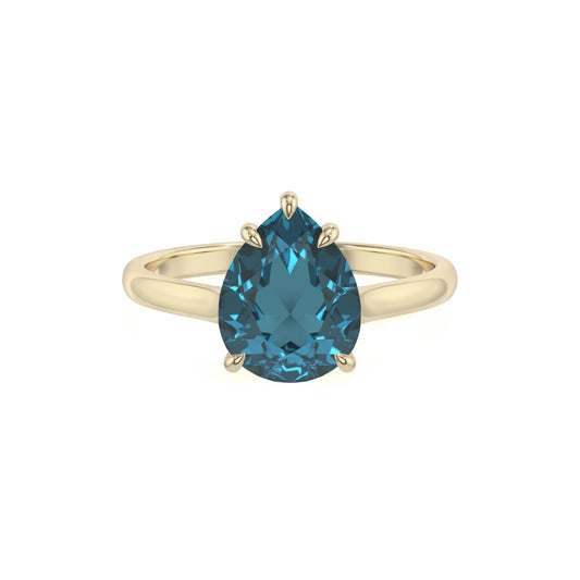 natural london-blue-topaz pear solitaire rings in yellow gold 