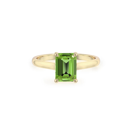 natural peridot emerald cut solitaire rings in yellow gold 