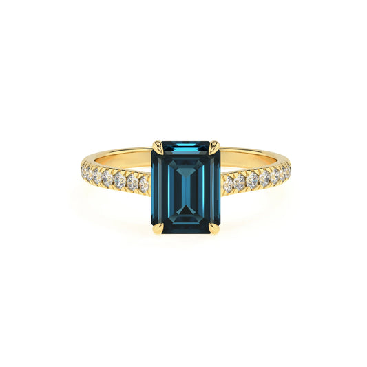 natural london-blue-topaz emerald cut half eternity solitaire engagement rings in yellow gold 