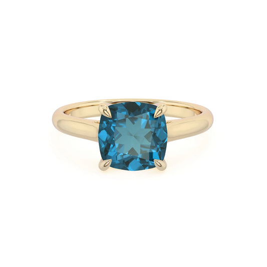 natural london-blue-topaz cushion solitaire rings in yellow gold 