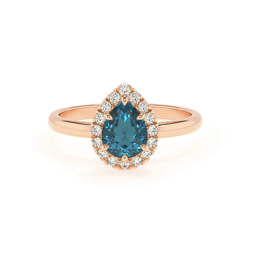 natural london-blue-topaz pear solitaire rings in rose gold 
