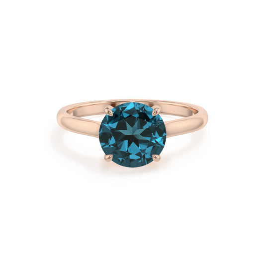 natural london-blue-topaz round solitaire rings in rose gold 