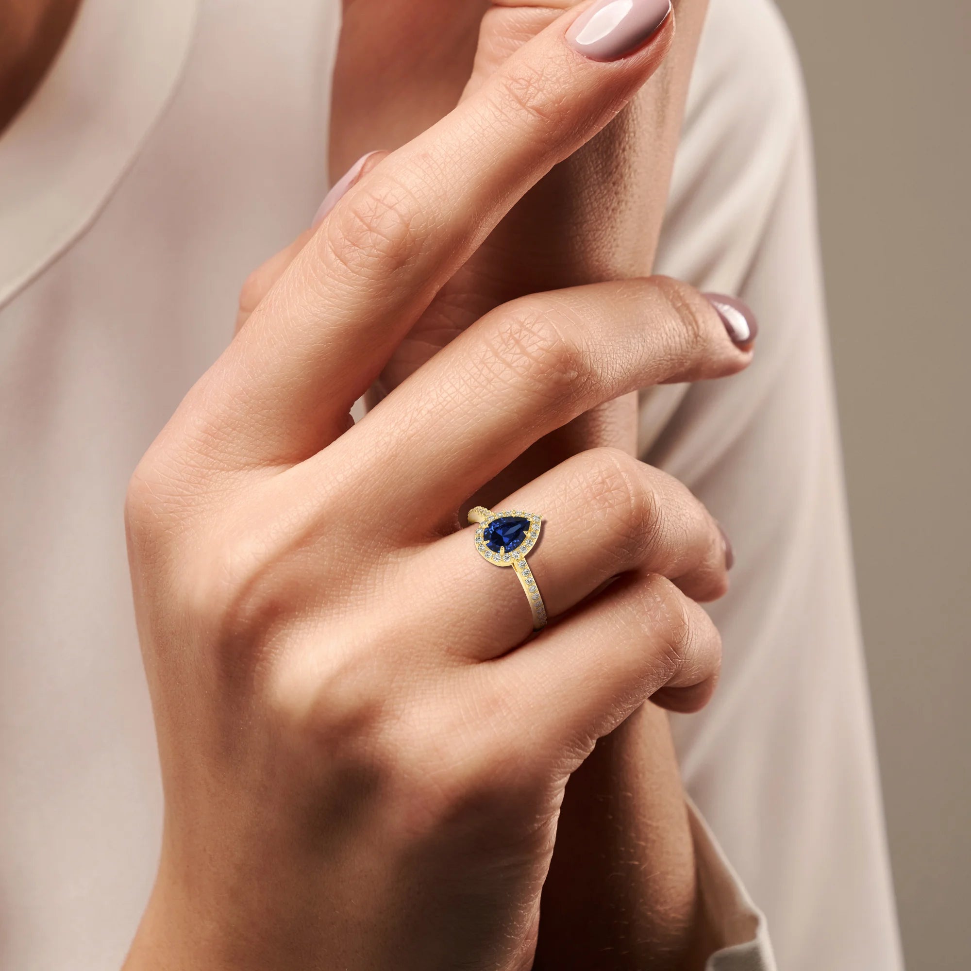 lab grown blue-sapphire pear solitaire rings in yellow gold 