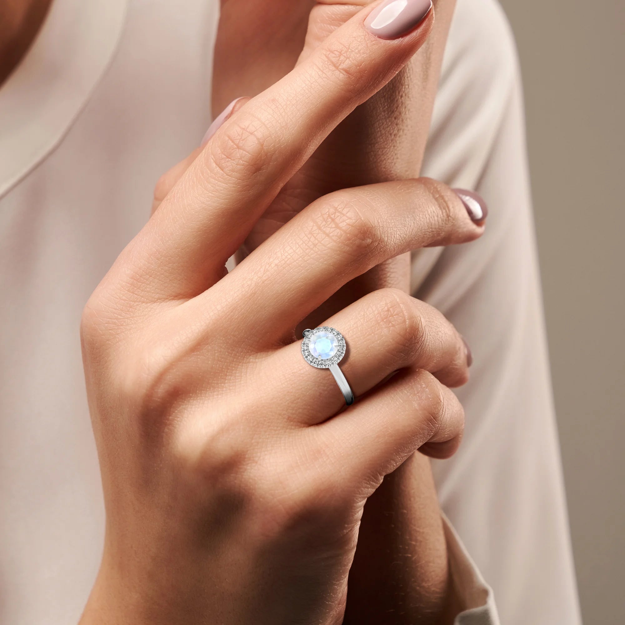 natural rainbow-moonstone round solitaire rings in platinum 