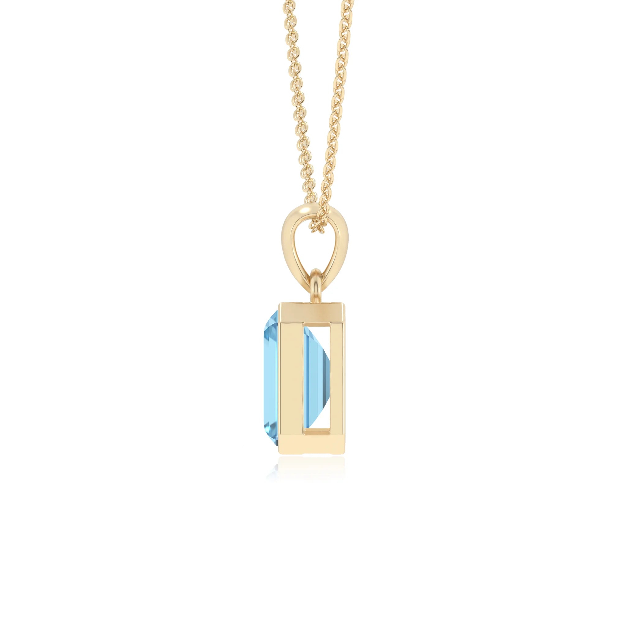 natural swiss-blue-topaz emerald cut solitaire necklaces in yellow gold 