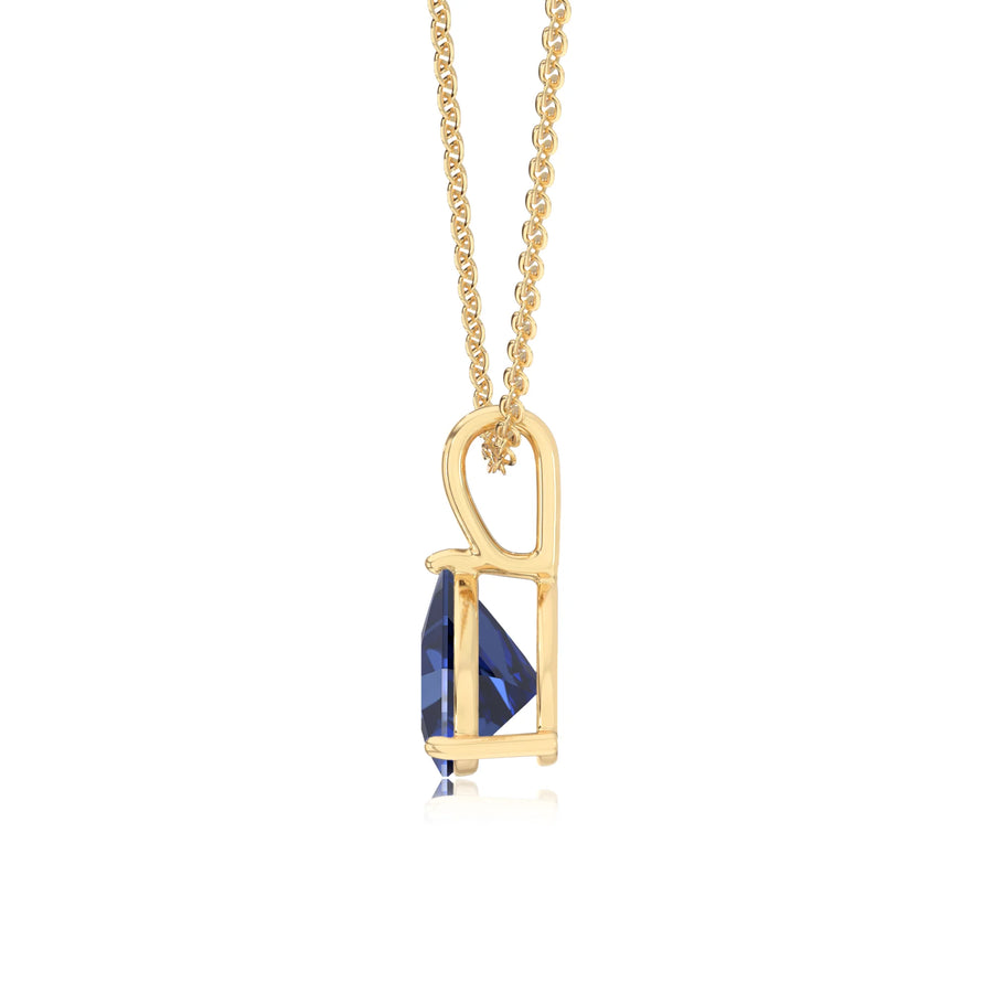 lab grown blue-sapphire trillion solitaire necklaces in yellow gold 